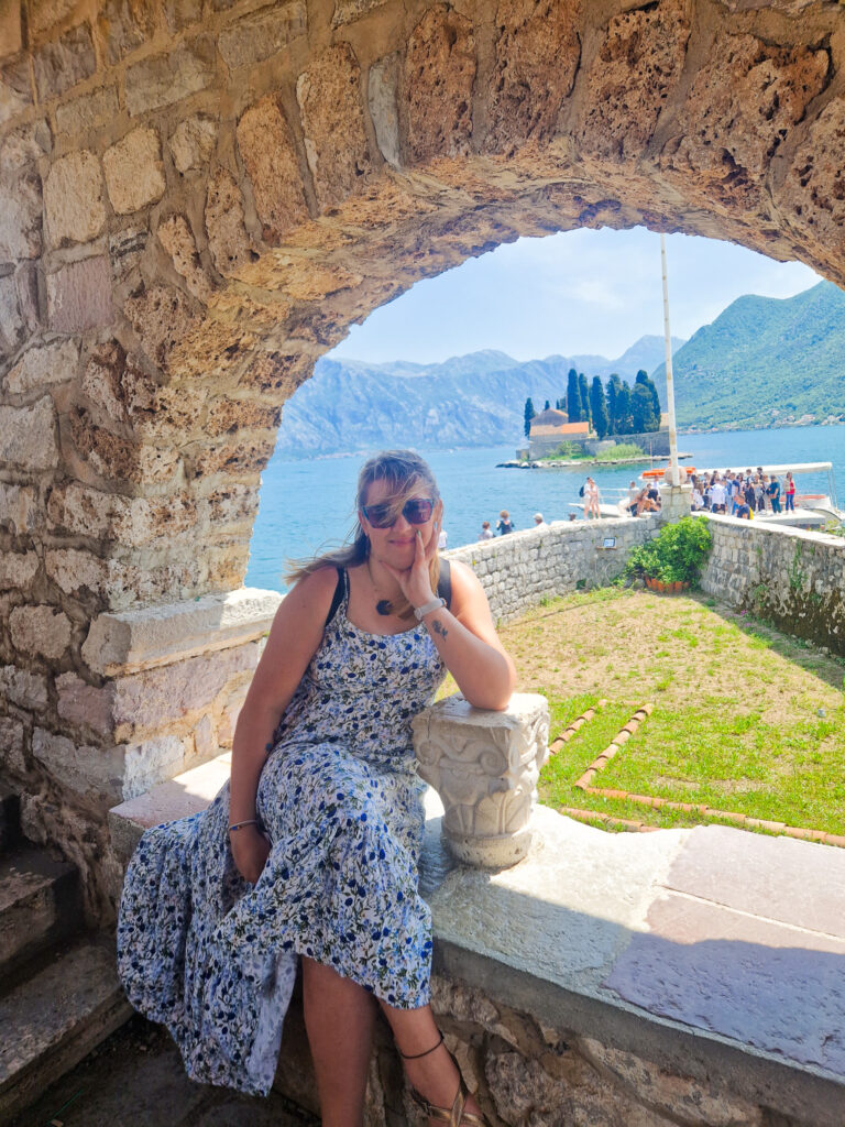 Em sitting in an arched window, Our Lady of the Rocks Church