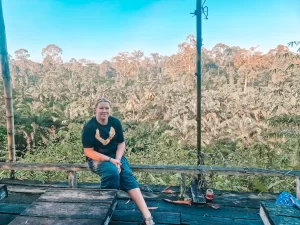 Em in front of a jungle panorama