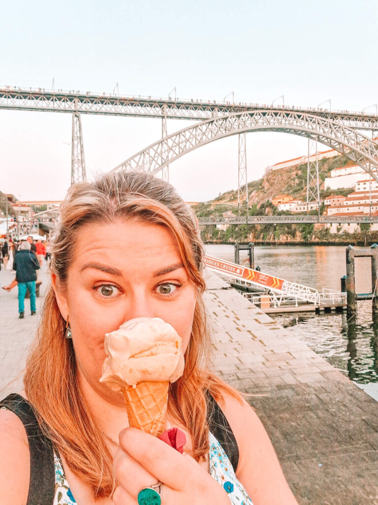 Em eating a very large iceceram with the dom Luis bridge in the background