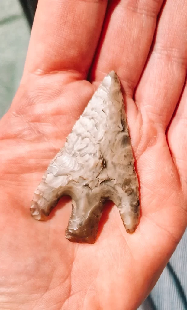 stone axehead on hand