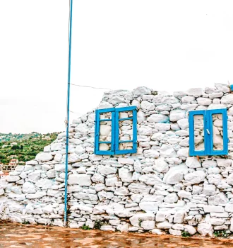 white wall with blue windows