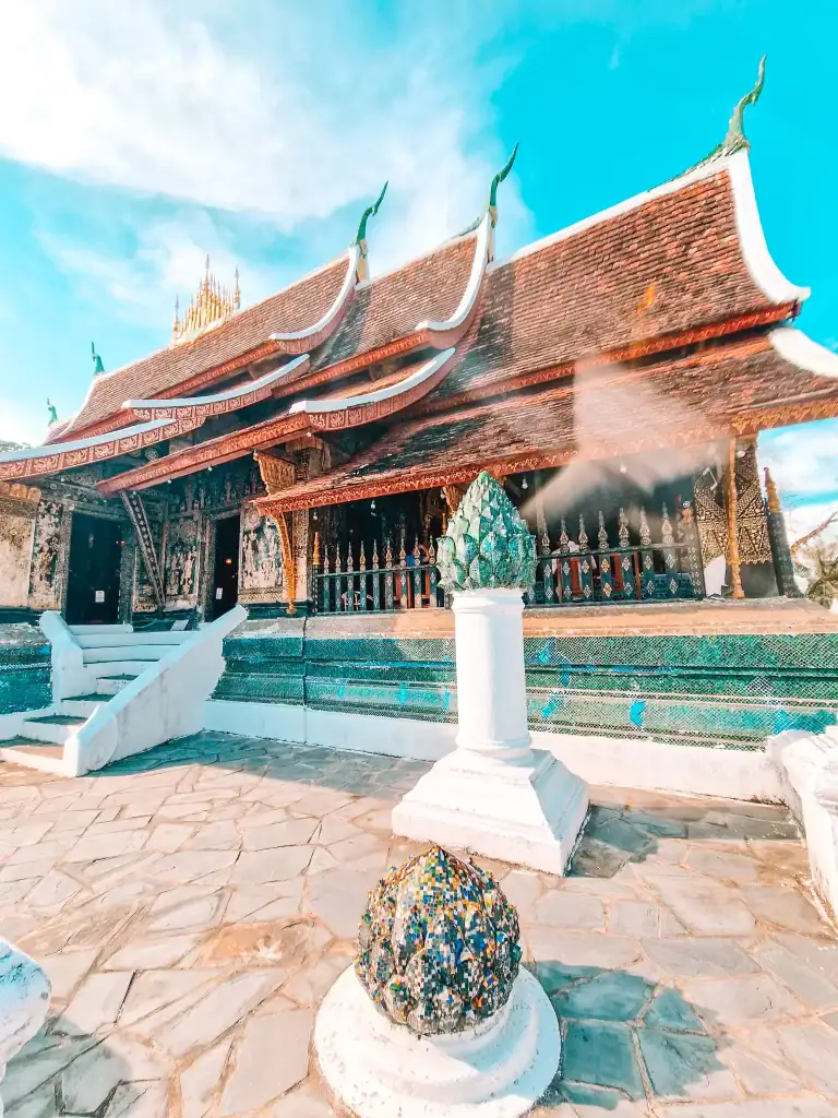 The intricate Wat Xieng Thong temple in Luang Prabang, known for its detailed carvings and sweeping rooflines, showcasing the rich heritage among the best things to do in Luang Prabang.