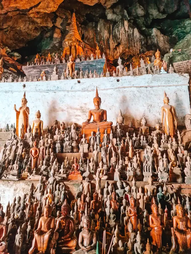 Rows of Buddha statues of various sizes and postures fill the sacred Pak Ou Caves near Luang Prabang, making it a spiritually rich highlight among the best things to do in Luang Prabang.