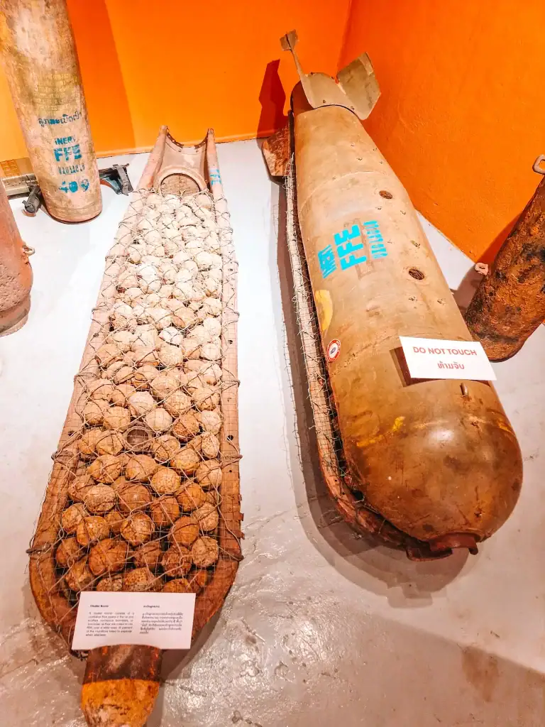 Decommissioned bombs and a cluster bomb casing displayed at the UXO museum in Luang Prabang, a sobering yet essential stop among the best things to do in Luang Prabang.