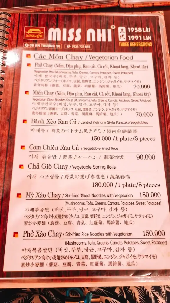 A Menu for Miss Nhi restaurant, featuring a variety of vegetarian dishes and their prices. Examples include vegetarian pho for 70K VND and Vegetable Fried Rice for 90K VND.