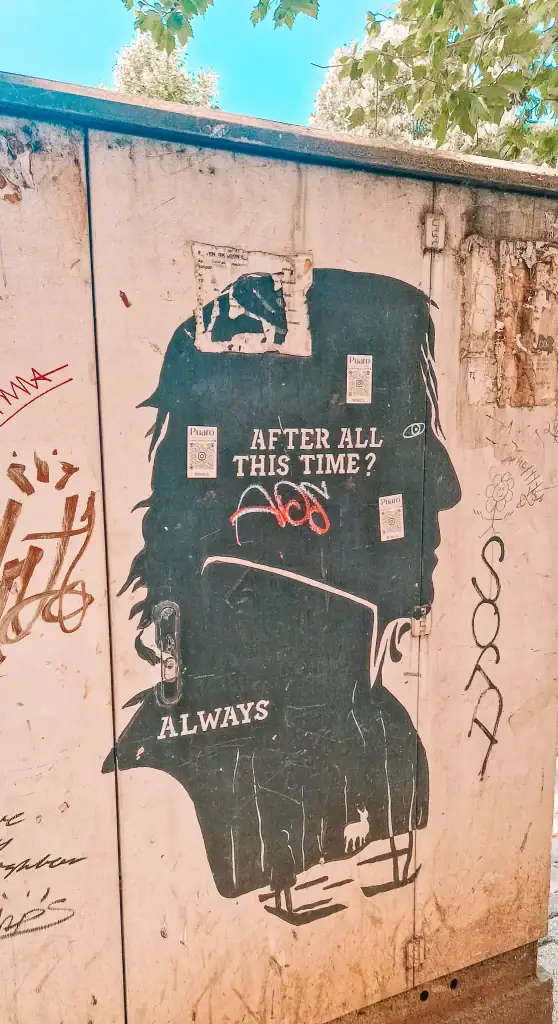 Black silhouette of Severus Snape with the words “After all this time? Always” stenciled on a weathered utility box—Tirana’s street art gets a magical Harry Potter twist.