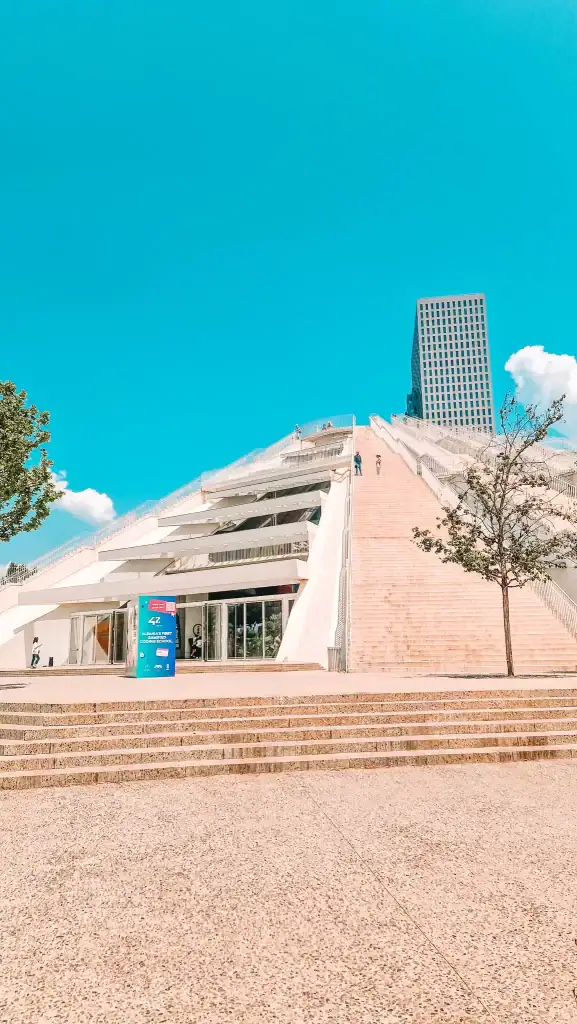 The newly renovated Pyramid of Tirana with its geometric glass panels and public staircases, now home to a tech school and a prime urban photo spot.