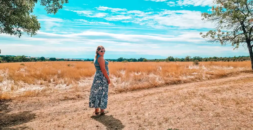 Em walking across golden meadows in Hisarya, a spa town famous for Roman ruins and thermal springs near Plovdiv.
