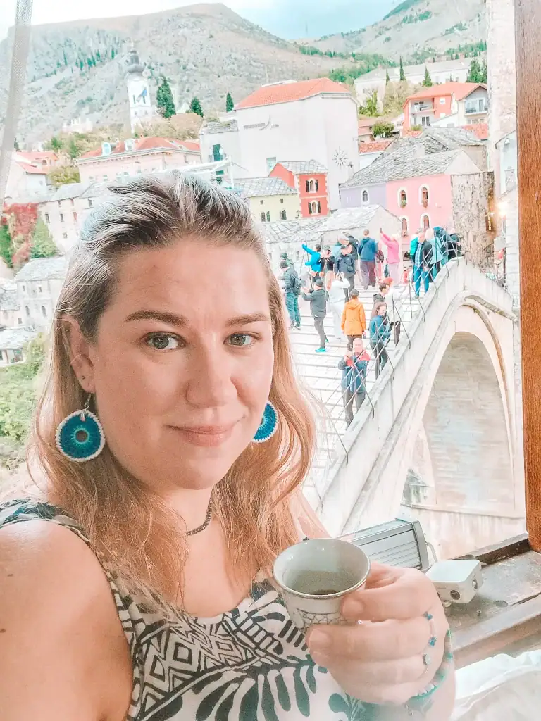 Sipping Bosnian coffee with a view! Enjoy the iconic panorama of Stari Most (Old Bridge) and the cobbled streets of Mostar from a cozy traditional cafe window. A perfect moment to relax and soak in the city’s charm.